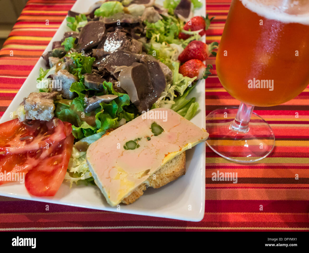France, Aude - Castelnaudary. Hotel de France. Salad with paté de foie gras and sliced duck gizzard (neck). Stock Photo