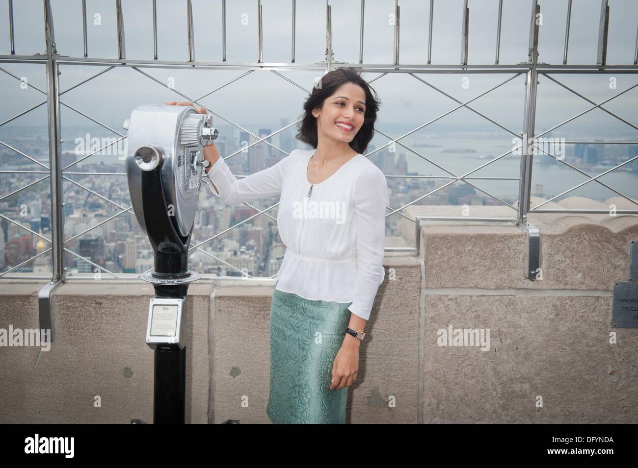 Manhattan, New York, USA. 10th Oct, 2013. Actress FREIDA PINTO lights