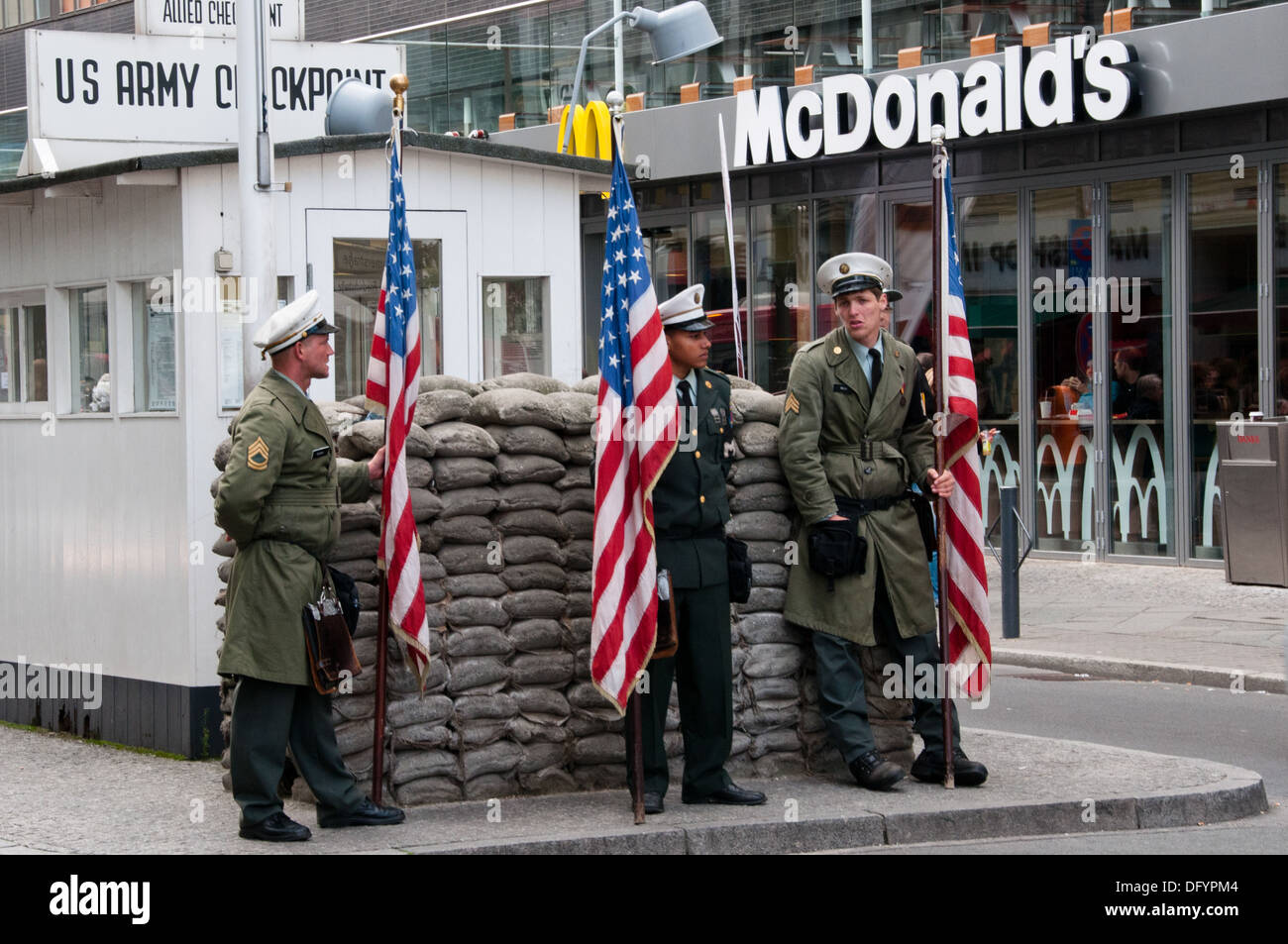 Actors pose as American soldiers at Checkpoint Charlie Stock Photo