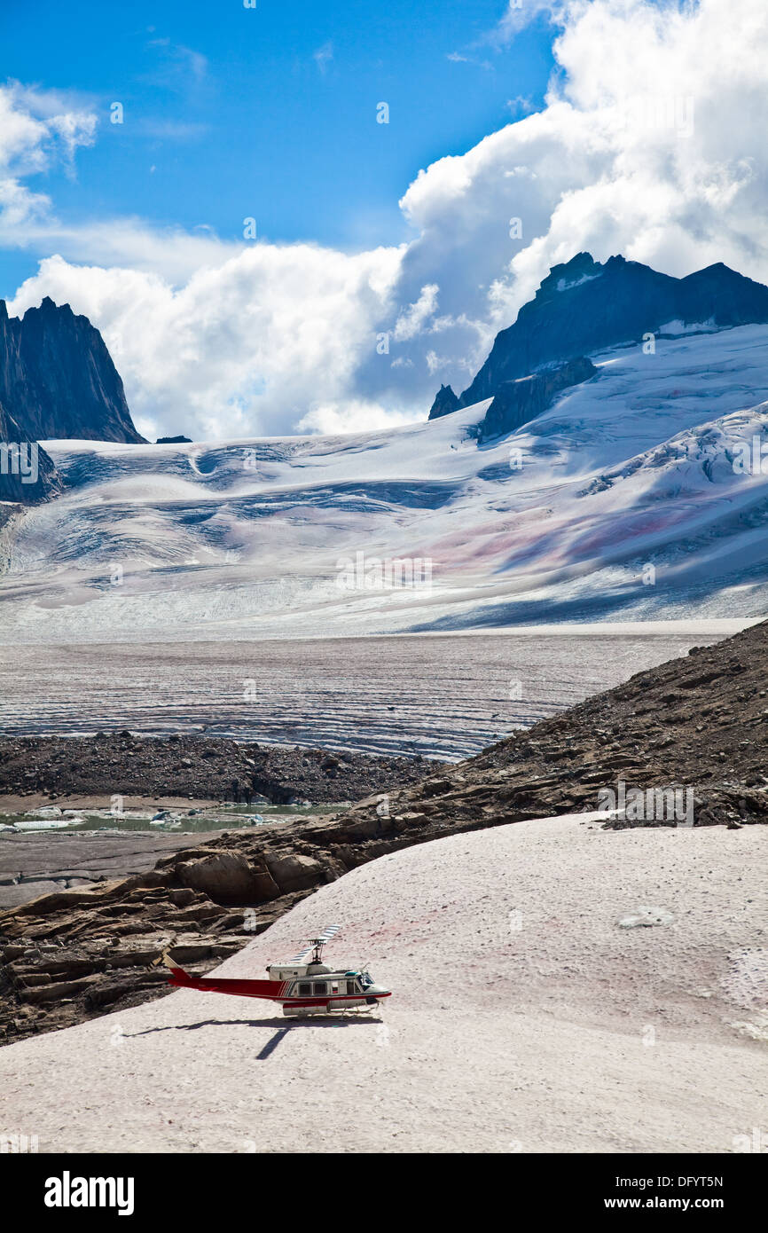 Helicopter parked adjacent the Upper Vowell Glacier in Bugaboo Provincial Park Stock Photo