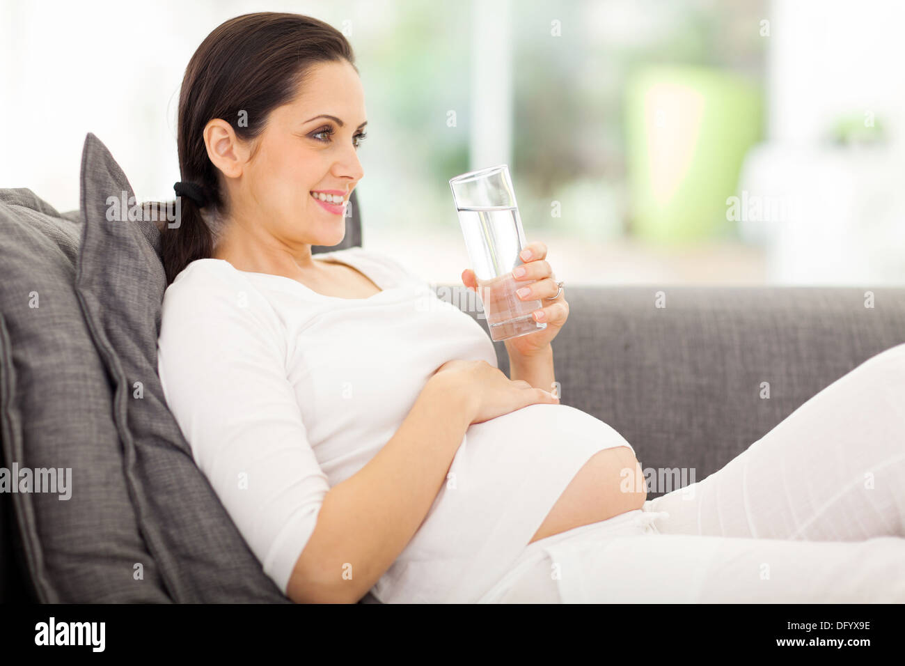 Pregnant woman lying sofa hires stock photography and images Alamy