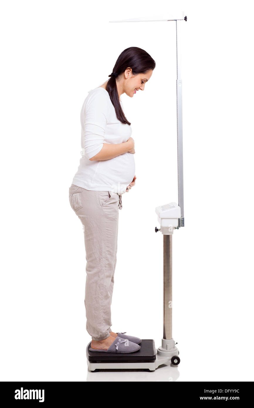 Woman standing on weight scales Stock Photo - Alamy
