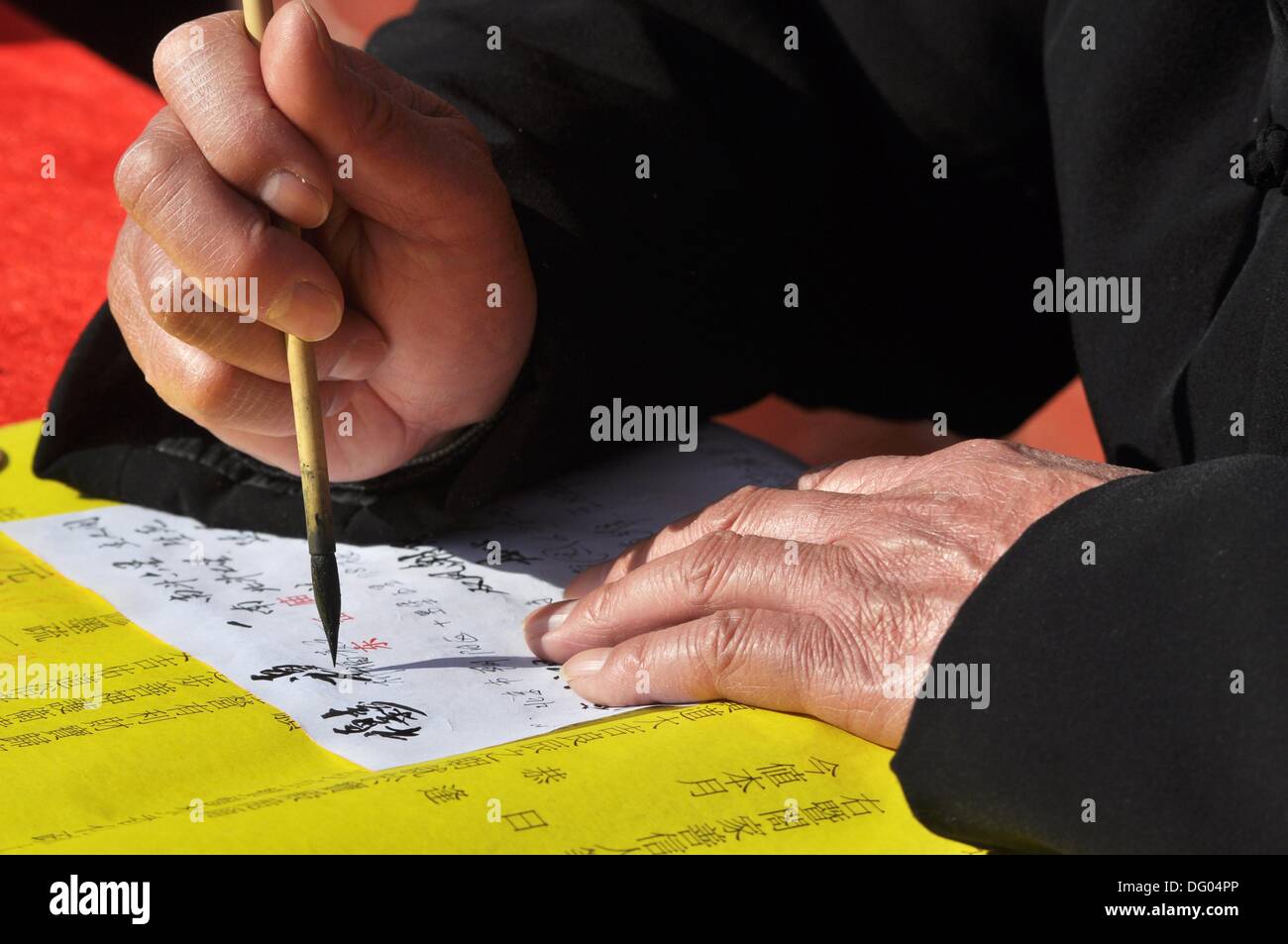 Beijing China A Priest Writing Chinese Ideograms At The Dongyue Temple During The Spring Beijing China A Priest Writing Chinese Ideograms At The Dongyue Temple During The Spring