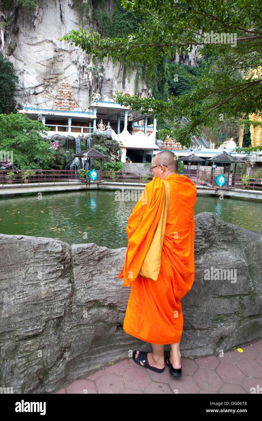 Buddhist Monk at Cave Villa Pond, Batu Caves, Kuala Lumpur, Malaysia Stock  Photo - Alamy