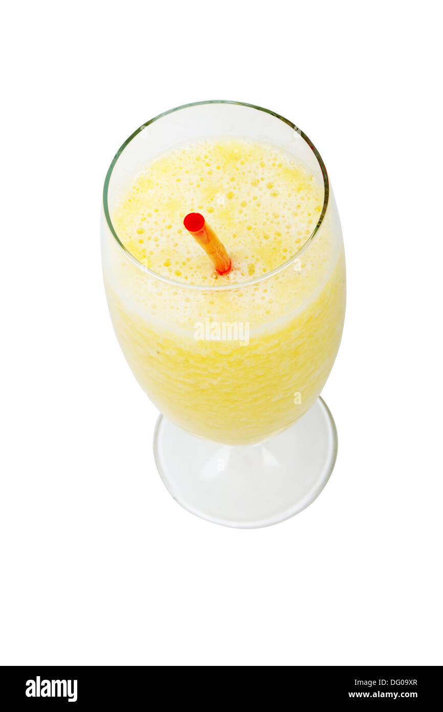 glass of fresh pineapple and banana juice with red straw Stock Photo