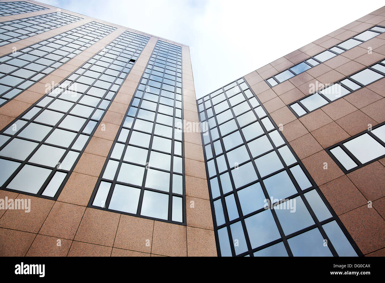 reflection of sky and clouds in modern office building in amsterdam ...