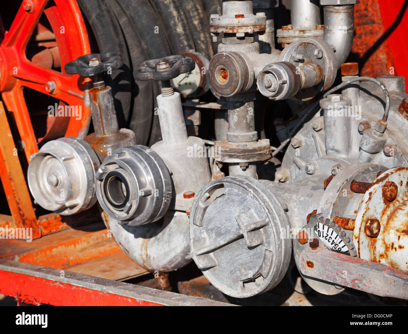 Water pump with hydrants. Firefighters Equipment of old fire truck Stock Photo
