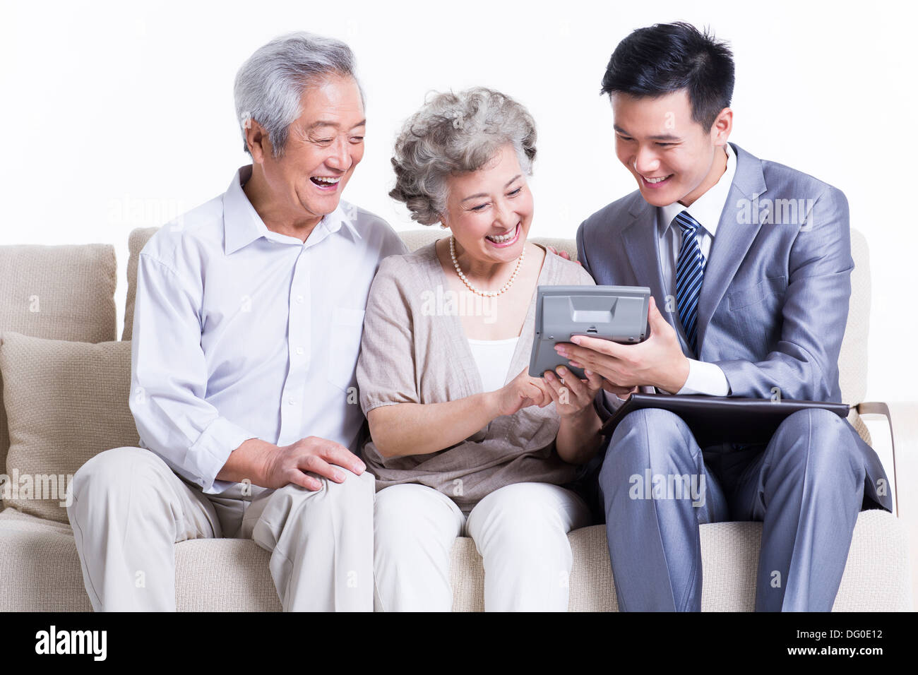 Senior couple with financial advisor Stock Photo