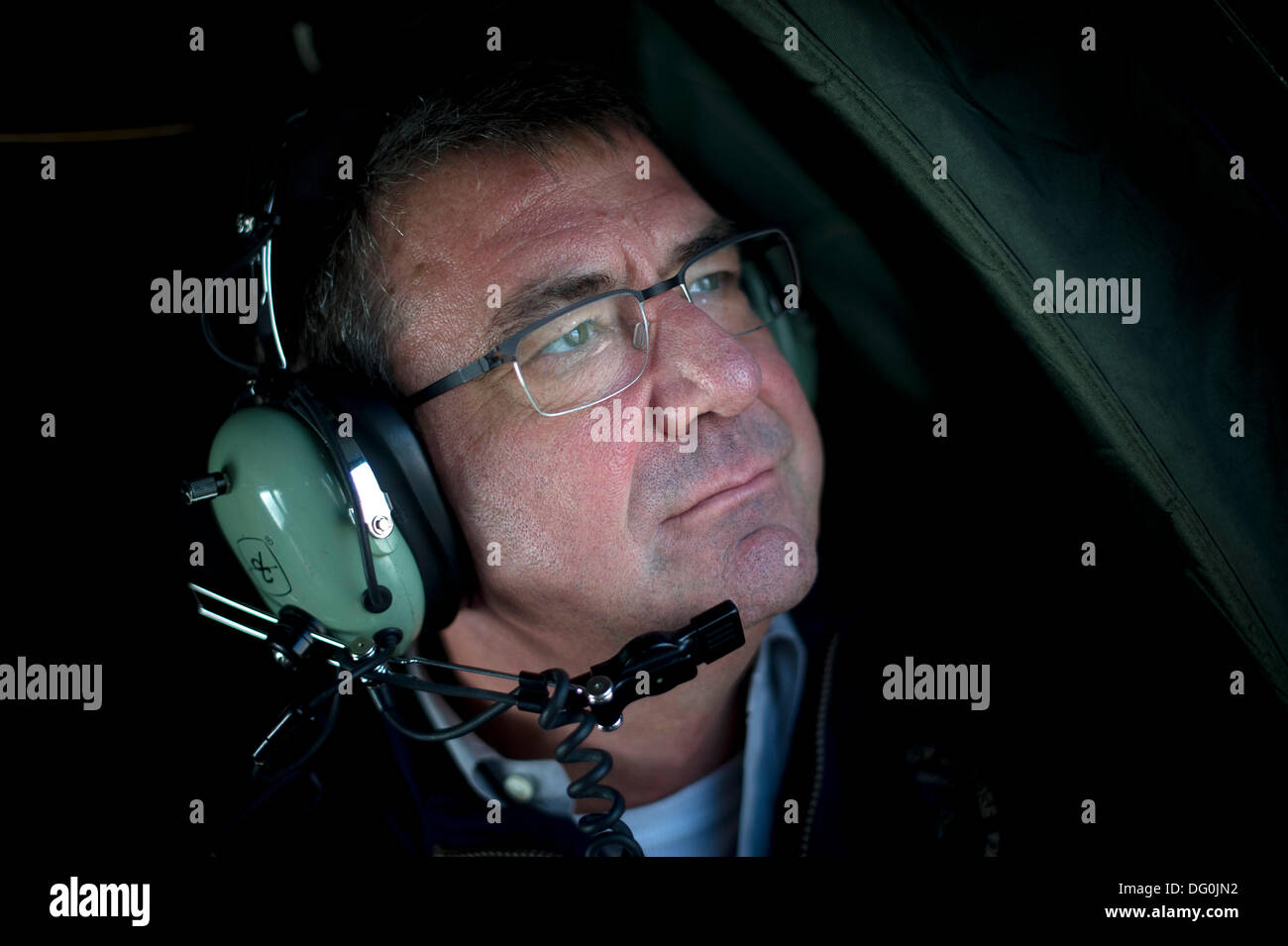 US Deputy Secretary of Defense Ashton B. Carter takes an aerial tour of areas devastated by Hurricane Sandy November 12, 2012 in Breezy Point, NY. Carter a theoretical physicist and former Harvard professor resigned from the Pentagon October 10, 2013. Stock Photo