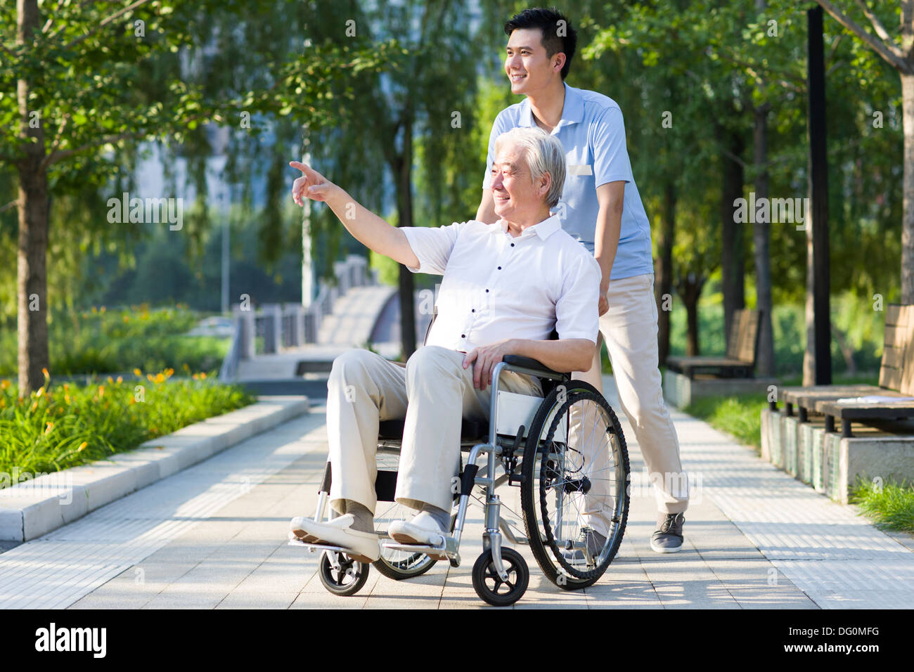 Wheelchair bound man with nursing assistant Stock Photo 61481716 Alamy