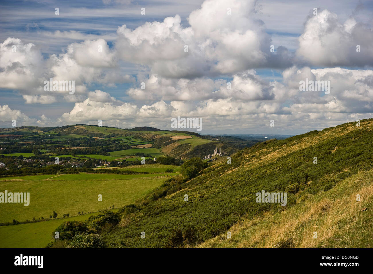 View of Corfe Castle in a gap in the Purbeck Hills, Dorset, UK Stock Photo