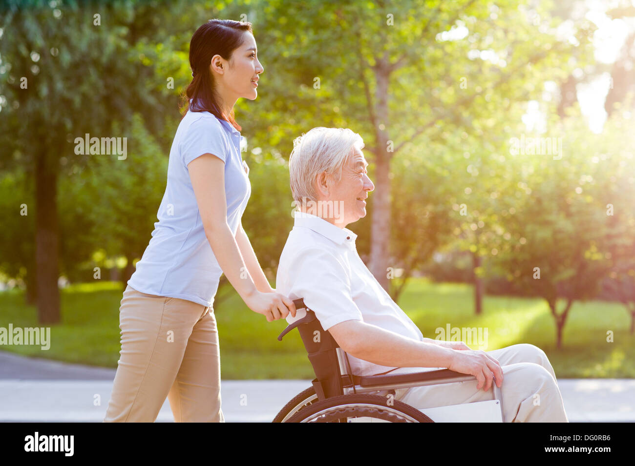 Wheelchair bound man with nursing assistant Stock Photo Alamy