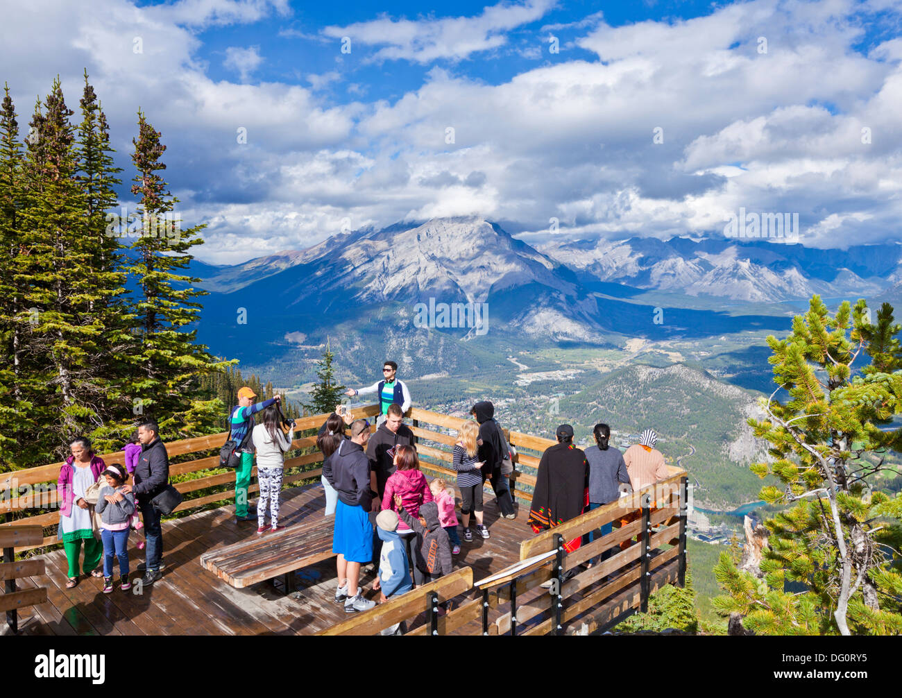 Visitors on a Viewing platform on Sulphur Mountain summit overlooking Banff National park Alberta Canadian Rockies Canada Stock Photo