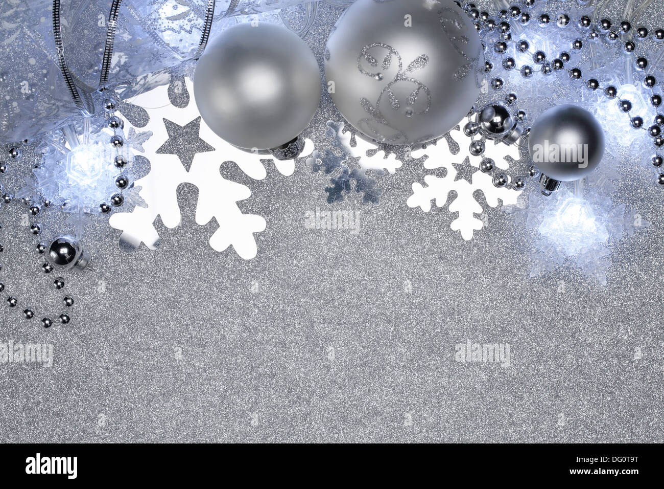 Christmas balls and star lights on silver background Stock Photo - Alamy