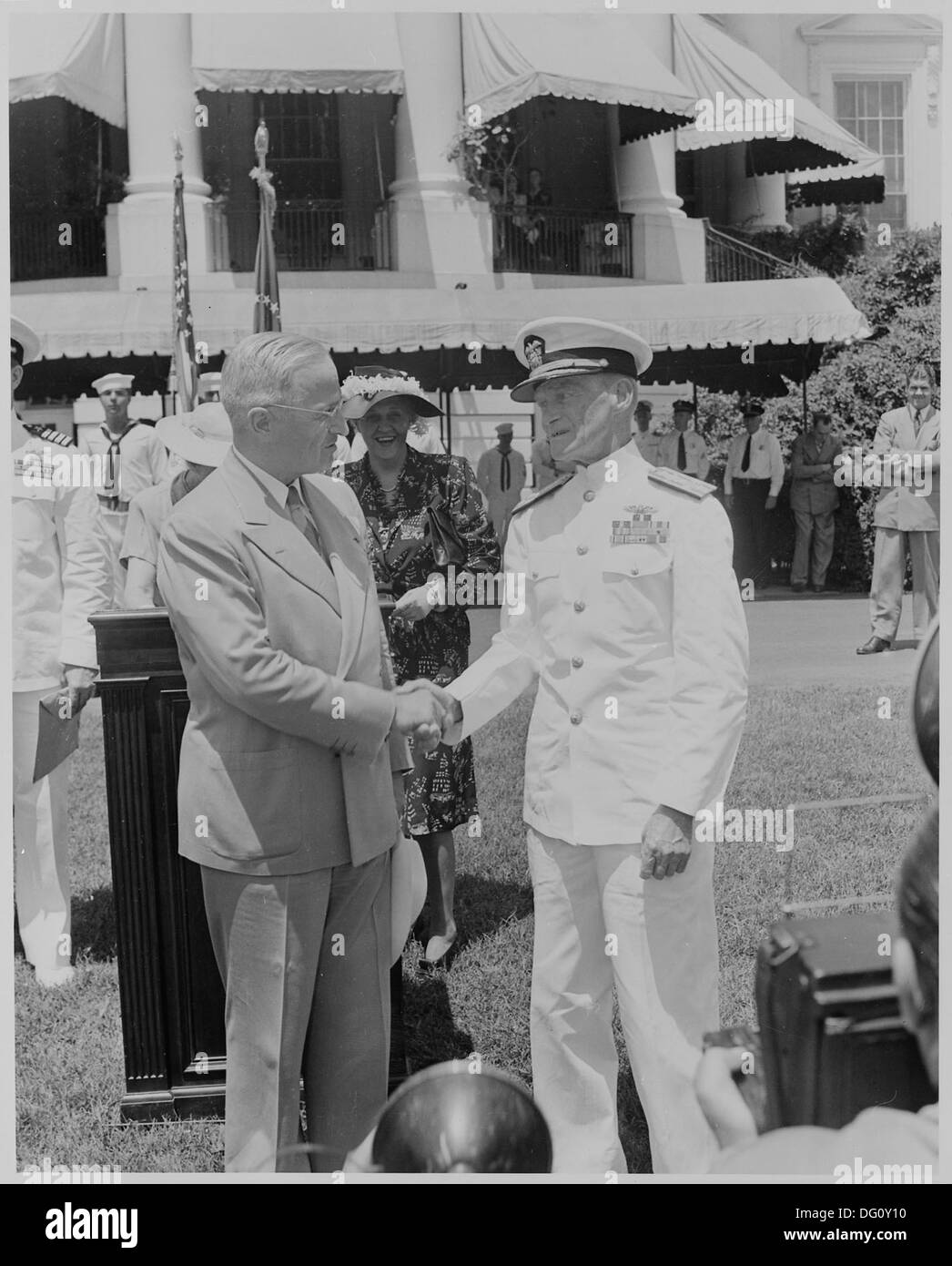 Photograph of President Truman shaking hands with Admiral Marc Mitscher, commander of the 8th Fleet and wartime... 199397 Stock Photo