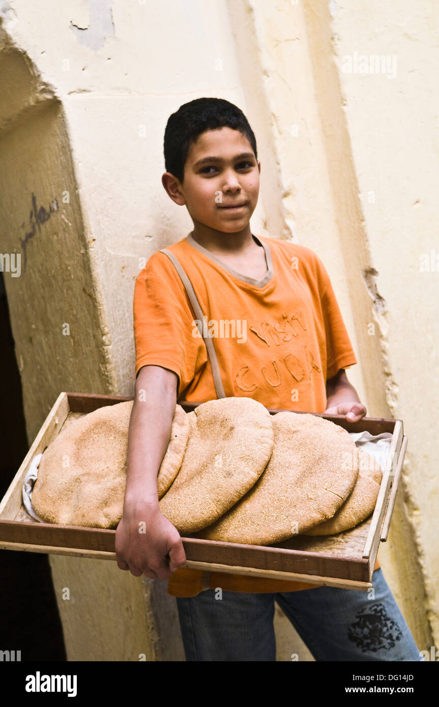 The pita bread delivery boy in fes hires stock photography and images