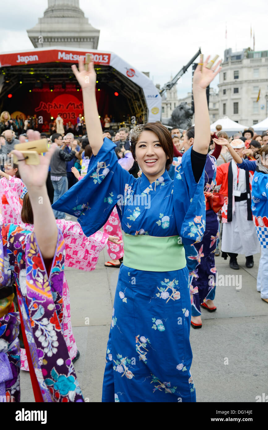 Japanese girl dancing at matsuri wearing traditional costume of kimono in London England. Oct 5, 2013 Stock Photo