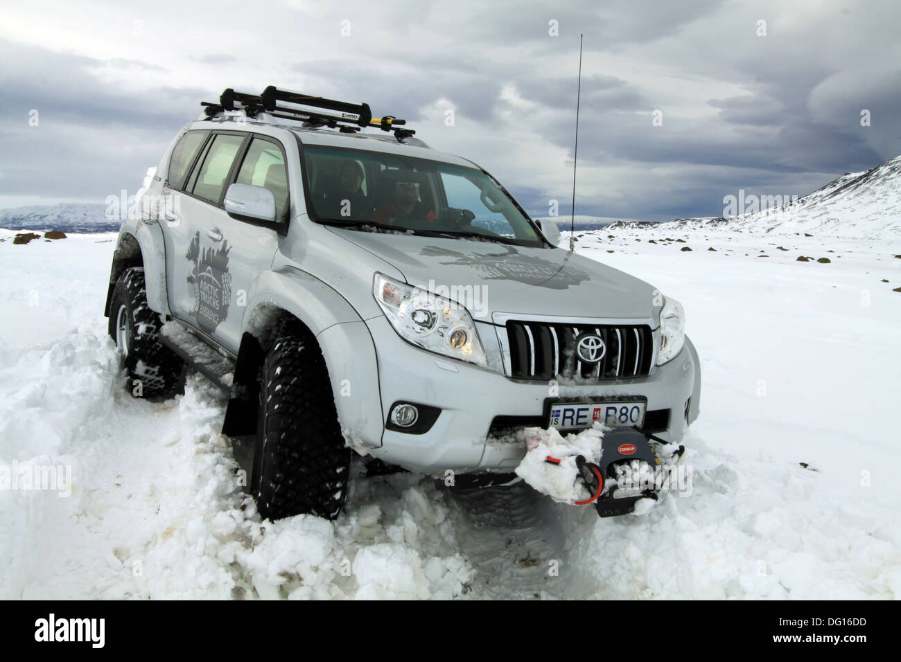 Arctic trucks heavily modified Toyota Landcruiser driving on snow in Iceland Stock Photo