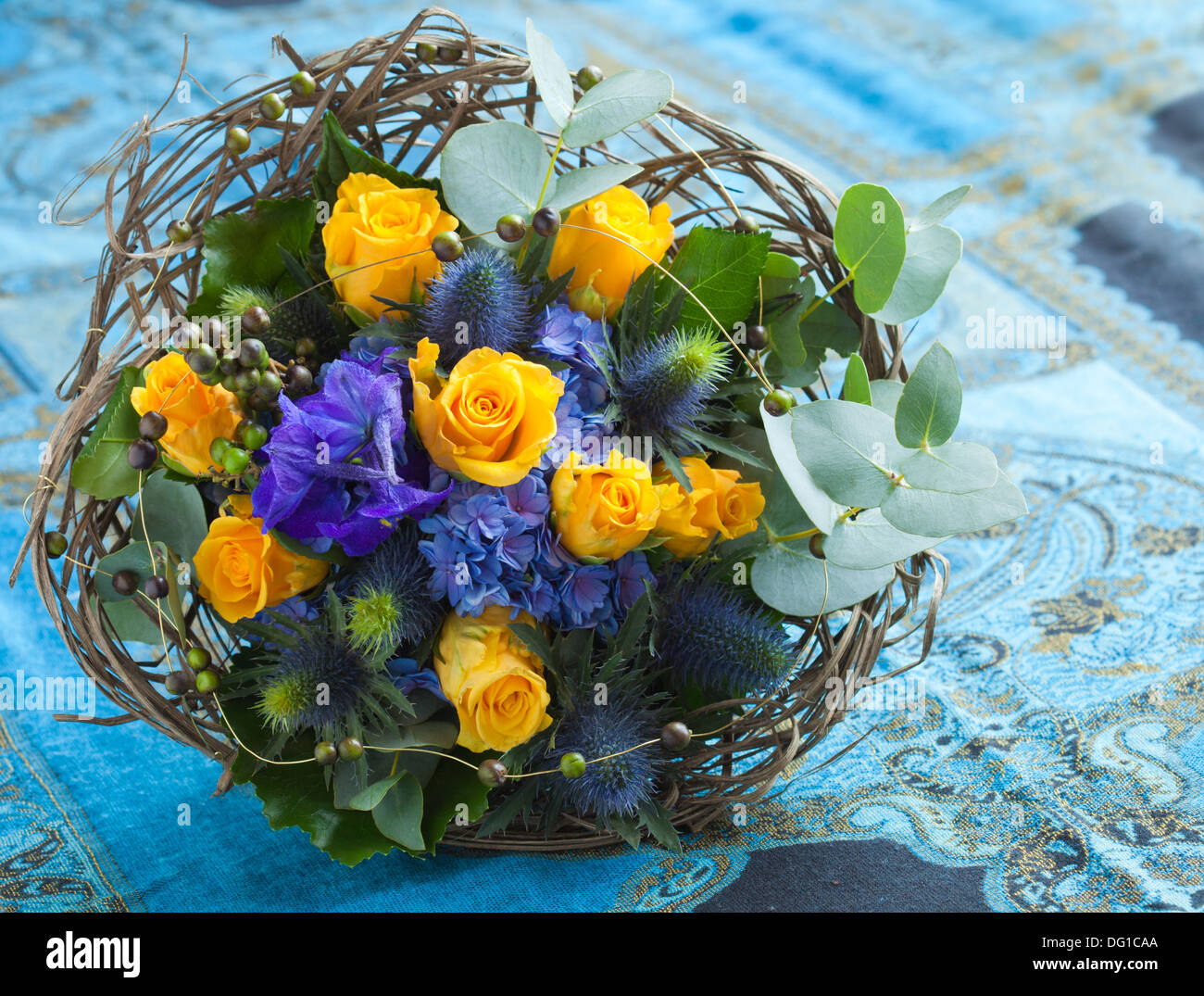 beautiful blue and yellow bouquet with roses Stock Photo