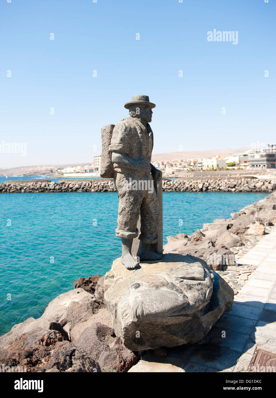 Statue of traditional fisherman on sea wall Stock Photo - Alamy