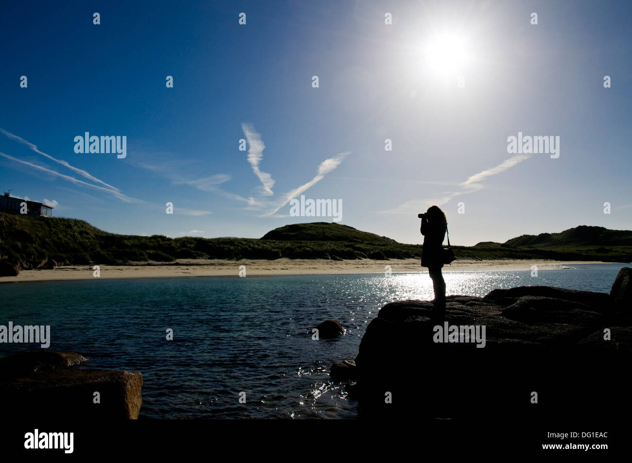 Woman takes digital photographs at Carrickfinn Kincasslagh County Donegal Ireland Stock Photo