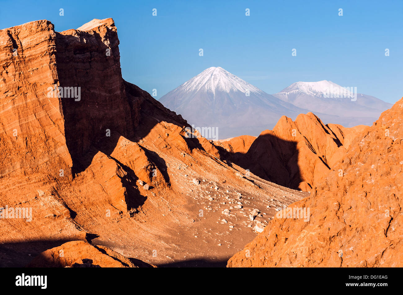 Moon Valley. Volcanoes Licancabur and Juriques,  Atacama, Chile Stock Photo