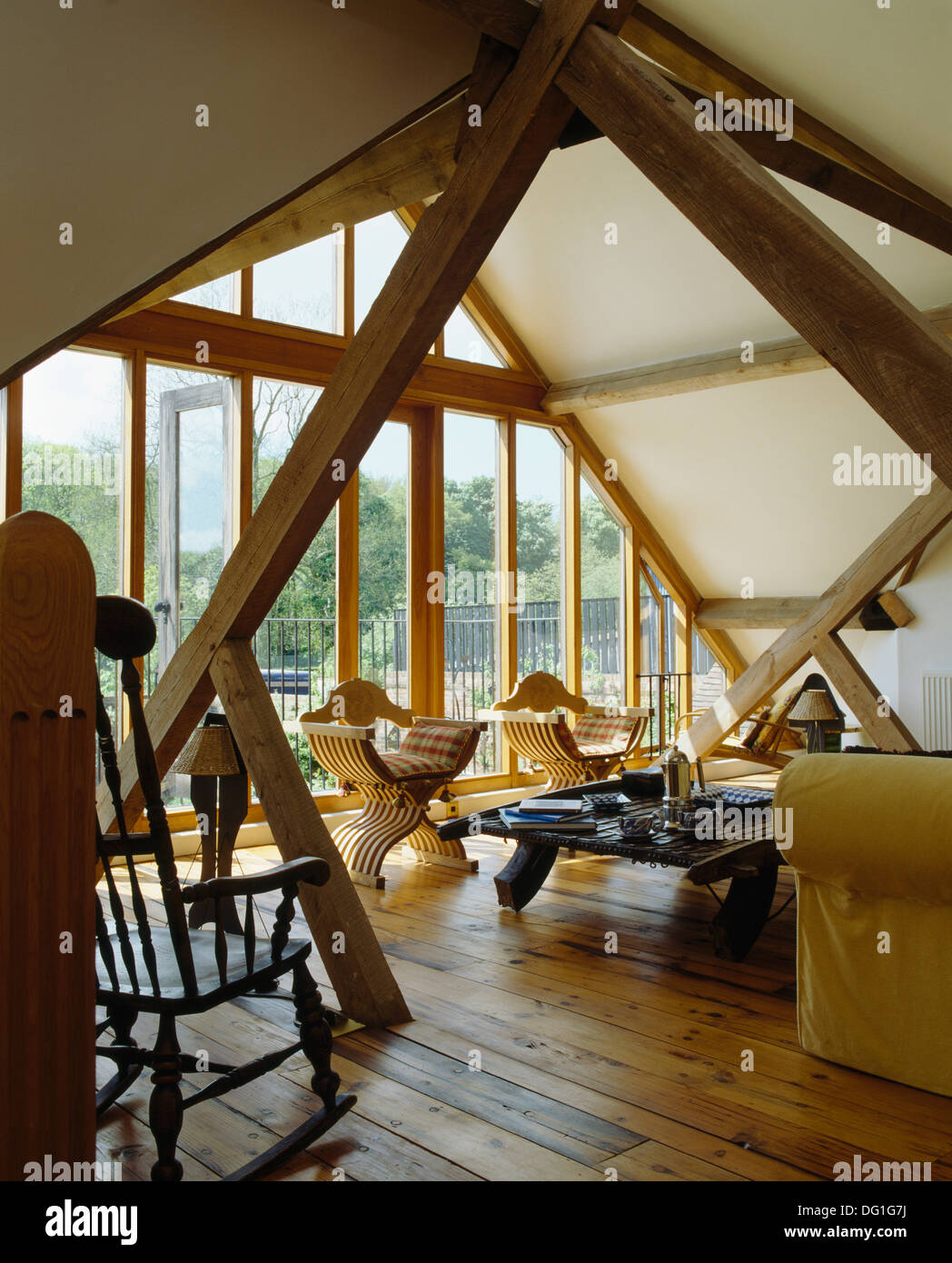Wooden Flooring In Country Barn Conversion Beamed Living Room With
