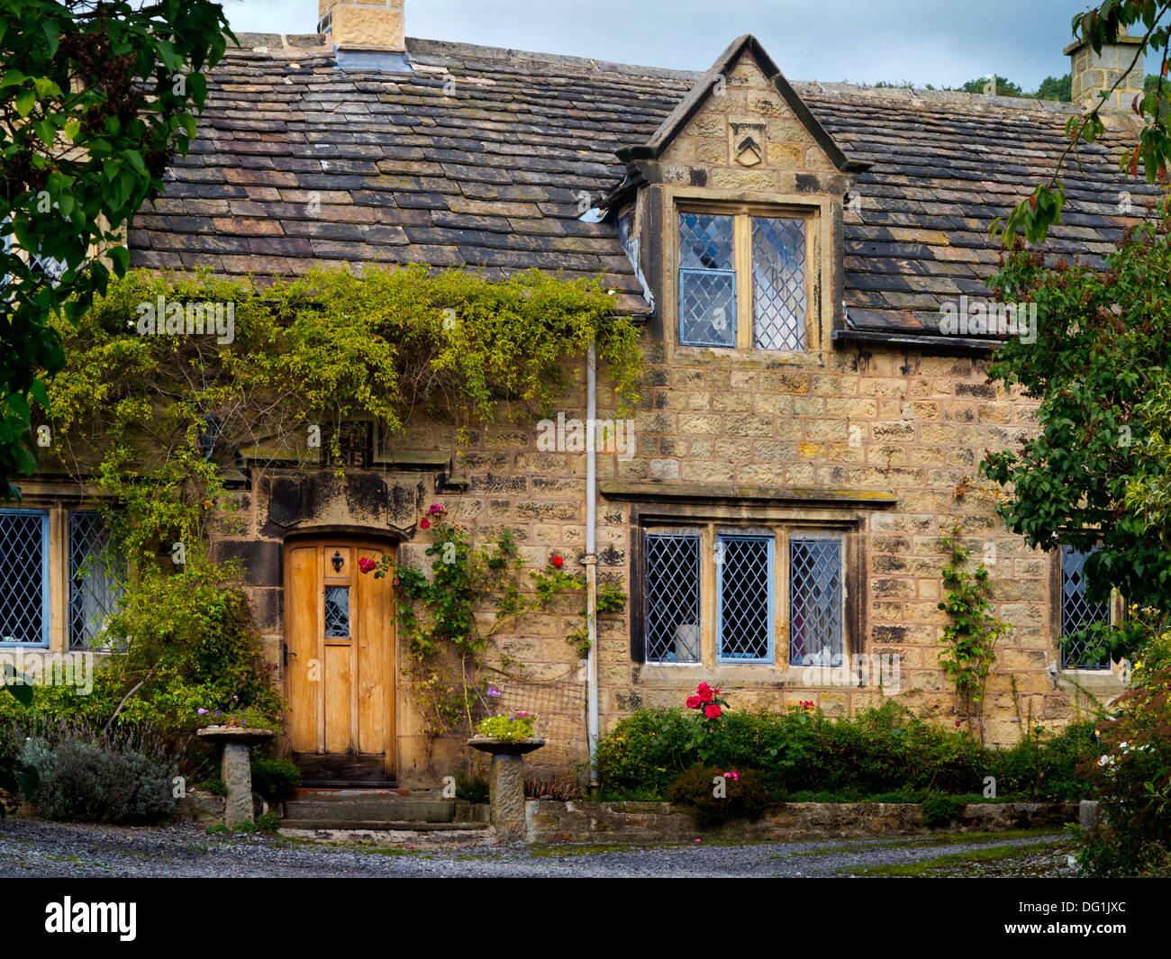 Traditional stone house in Eyam plague village in Derbyshire Peak District National Park England UK Stock Photo