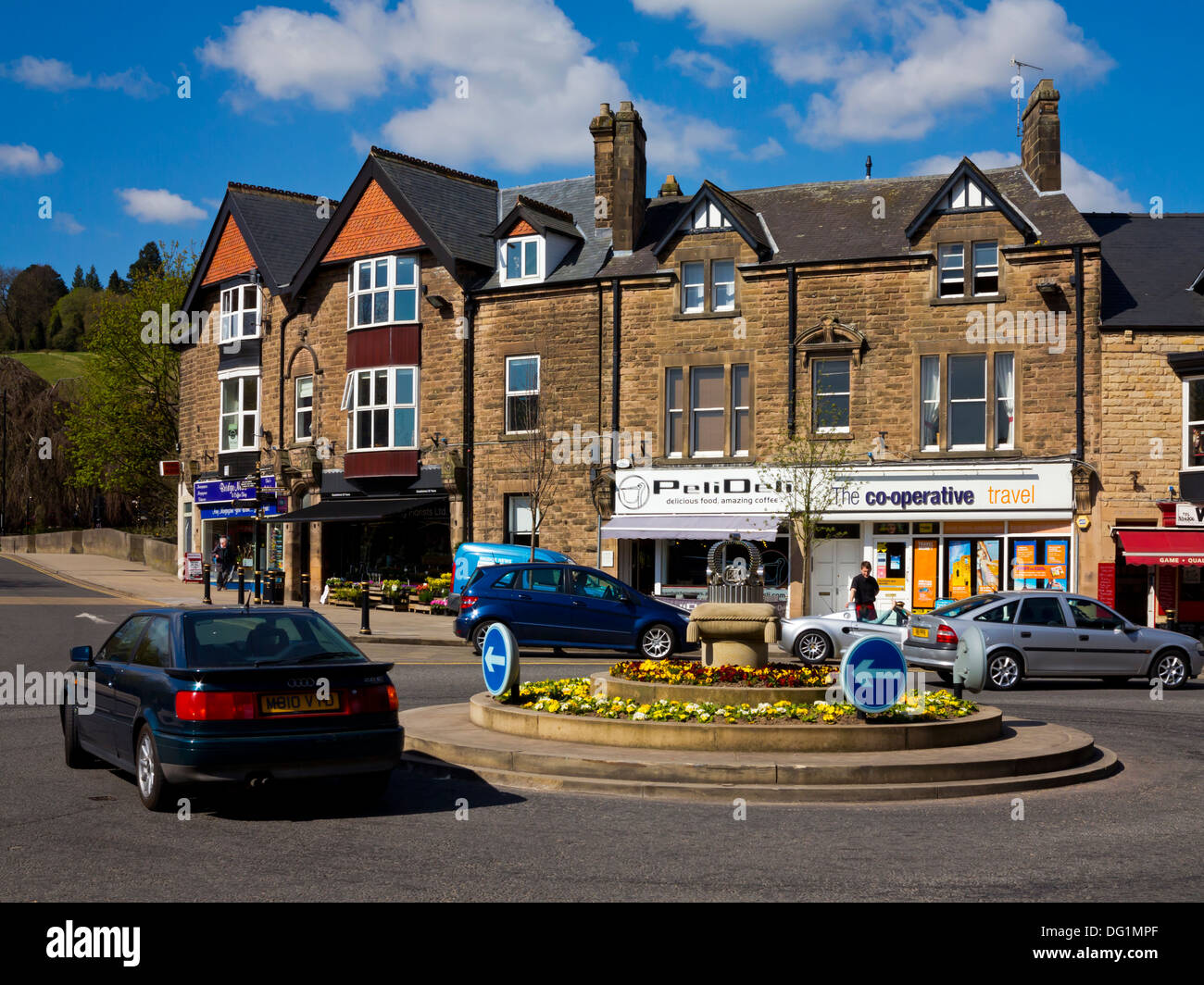 Traffic on roundabout in Crown Square in Matlock town centre Derbyshire Dales Peak District England UK Stock Photo
