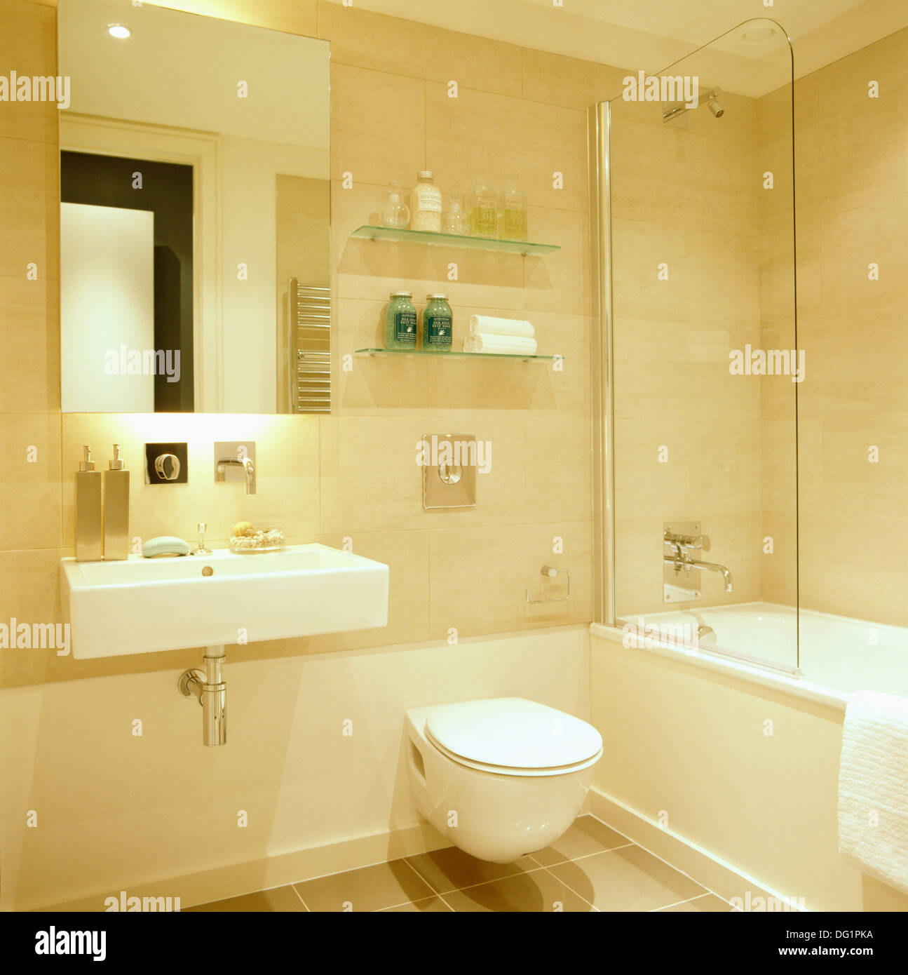 Mirror above rectangular basin in modern city bathroom with toilet