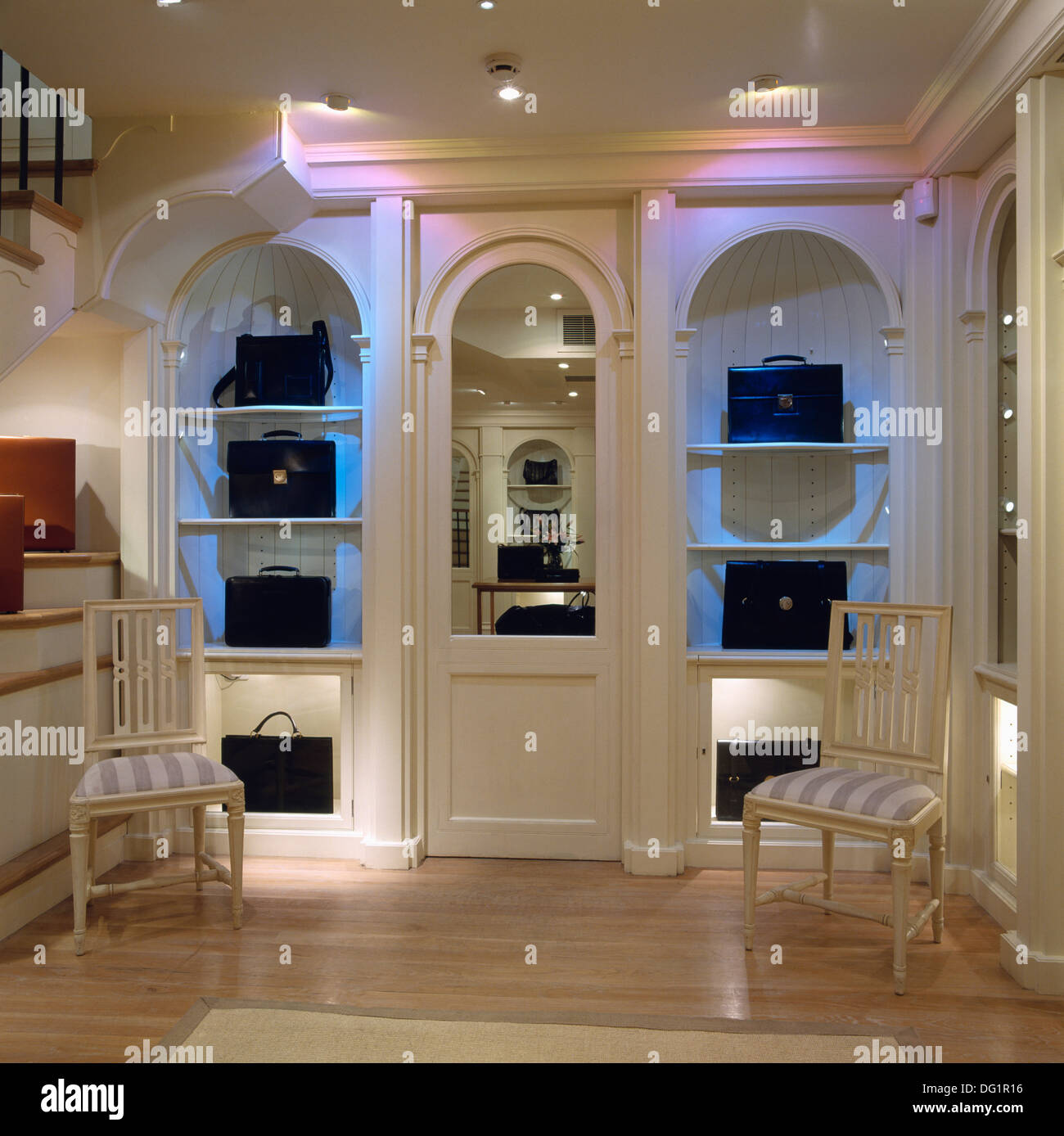 Leather briefcases on shelves in lighted display cupboards in Tanner