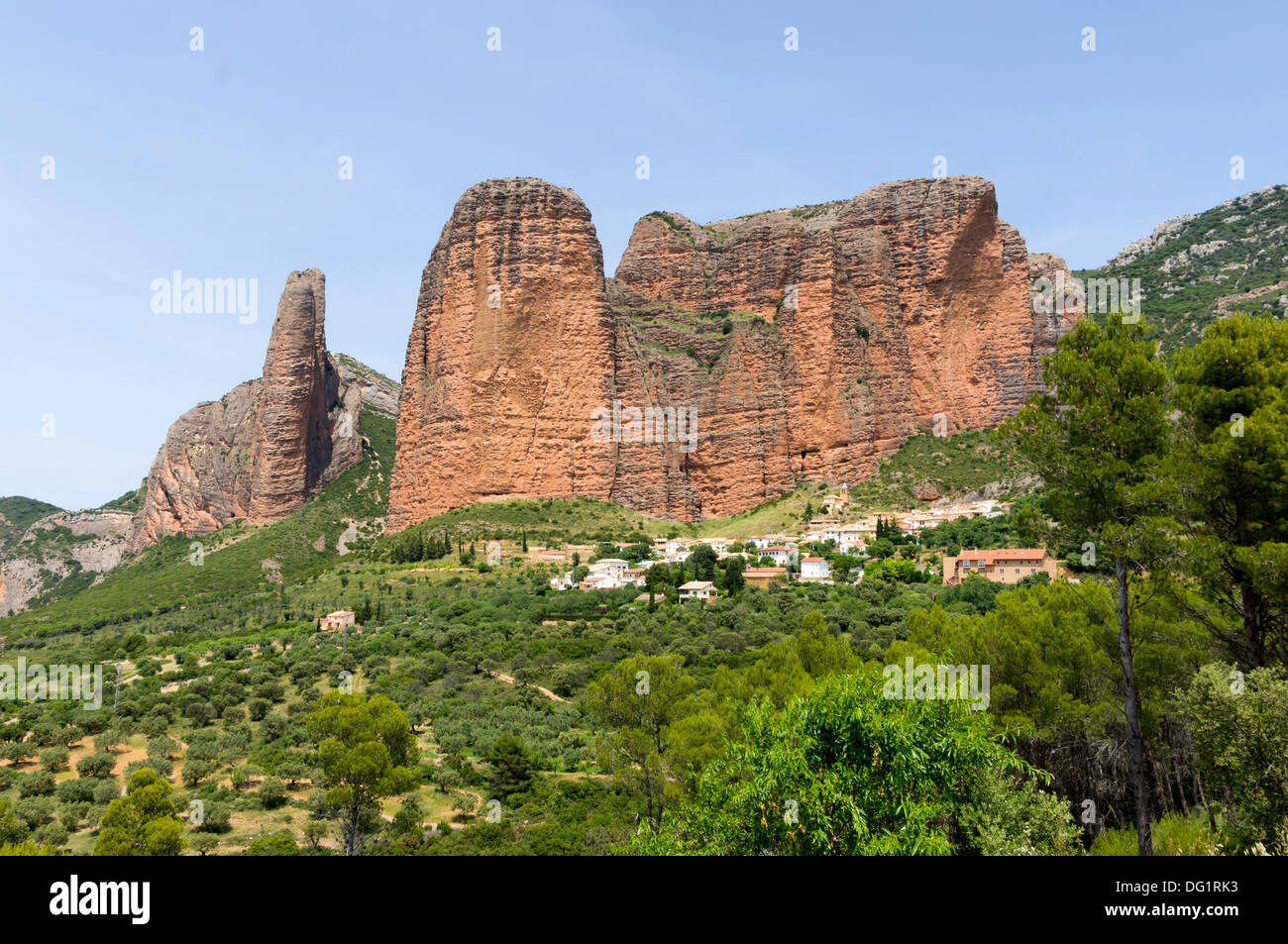 North-West Spain - Riglos, near Huesca. The village nestles below the huge sandstone butte called the Mallos de Riglos. Stock Photo