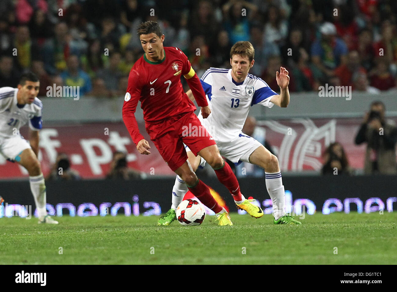 Lisbon, Portugal. 11th Oct, 2013. Cristiano Ronaldo, Portugal forward (L) and Sheran Yeini, Israel midfielder (R) during the qualifying soccer match for the Brazil 2014 FIFA World Cup, between Portugal and Israel, on October 11, 2013, in Alvalade stadium in Lisbon. Credit:  Action Plus Sports/Alamy Live News Stock Photo