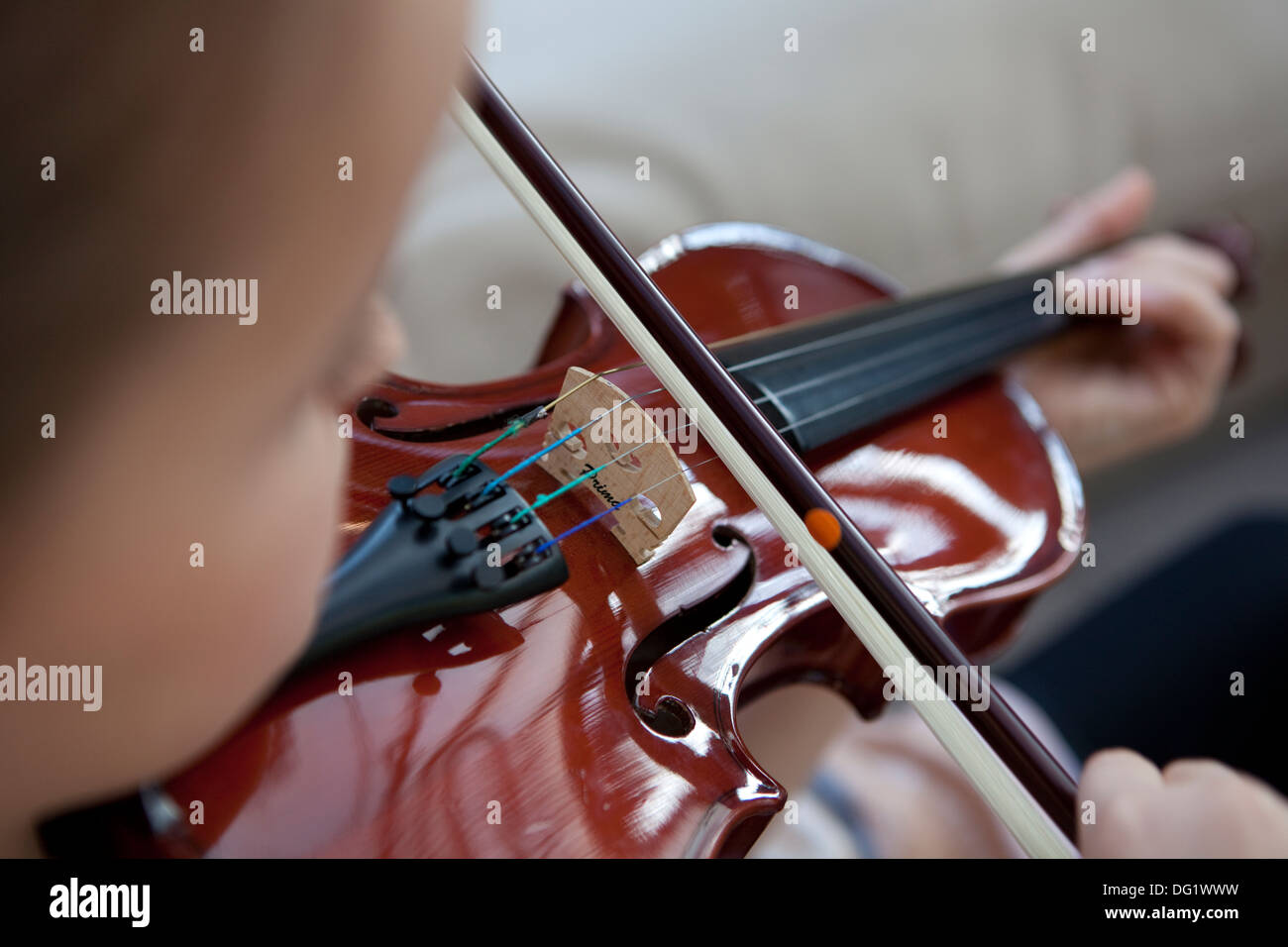 Young girl playing a violin. Stock Photo