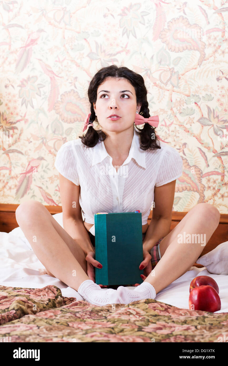 Woman in schoolgirl dress hold book and dream Stock Photo Alamy