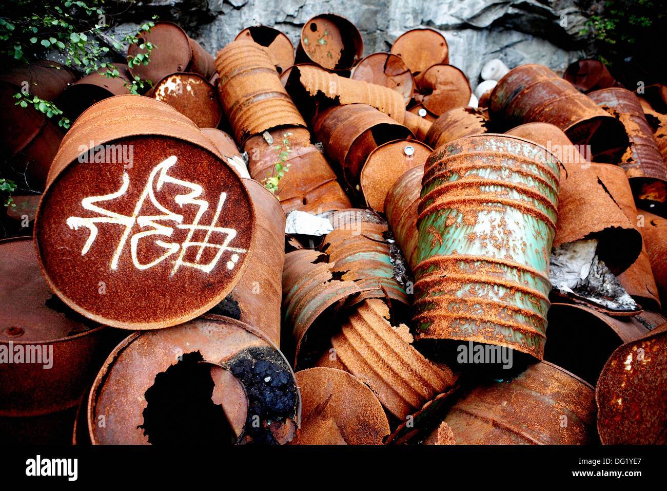 Pile of Rusted Metal Barrels Stock Photo