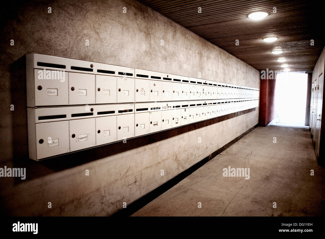 Two Rows of Mailboxes in Apartment Building Hallway Stock Photo