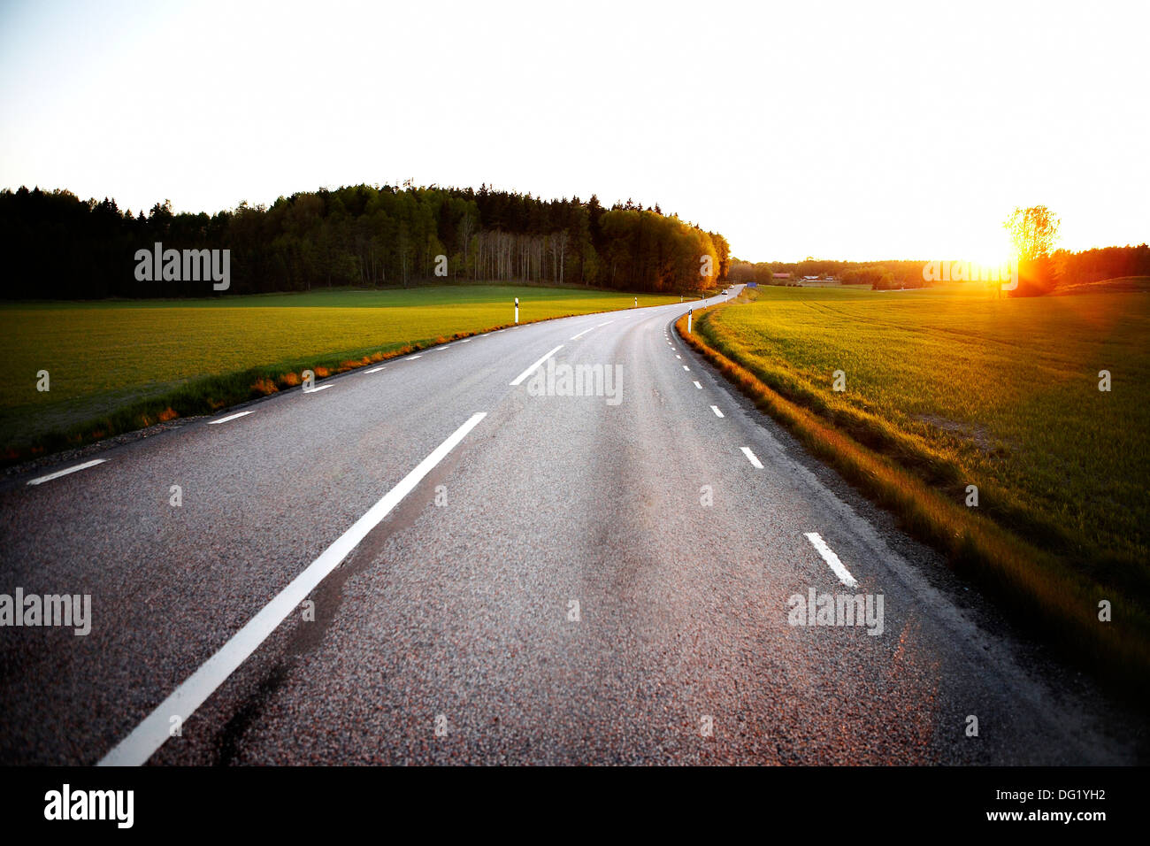 Rural Road at Sunrise, Sweden Stock Photo