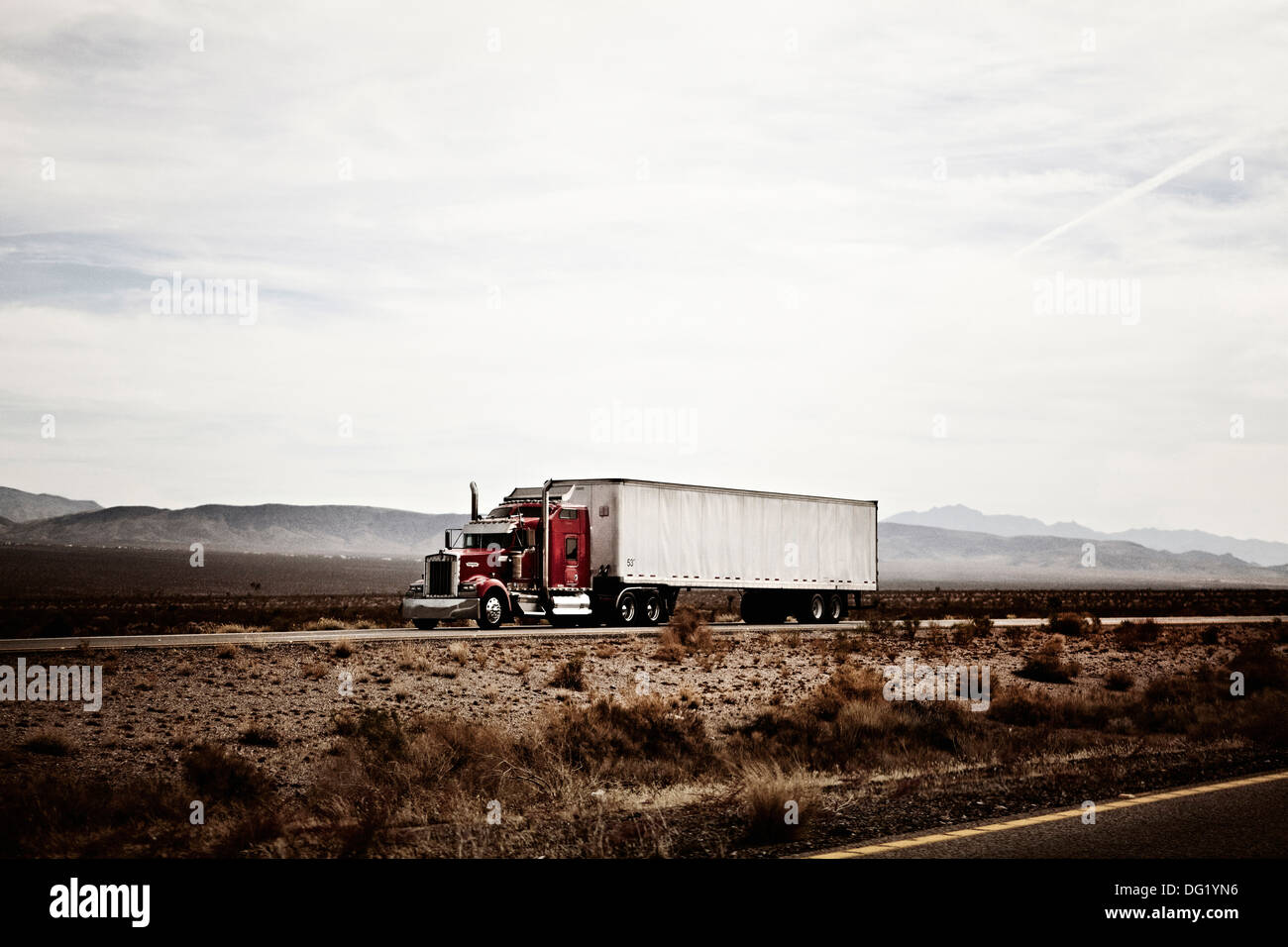 18-Wheel Truck on Desert Highway, Arizona, USA Stock Photo