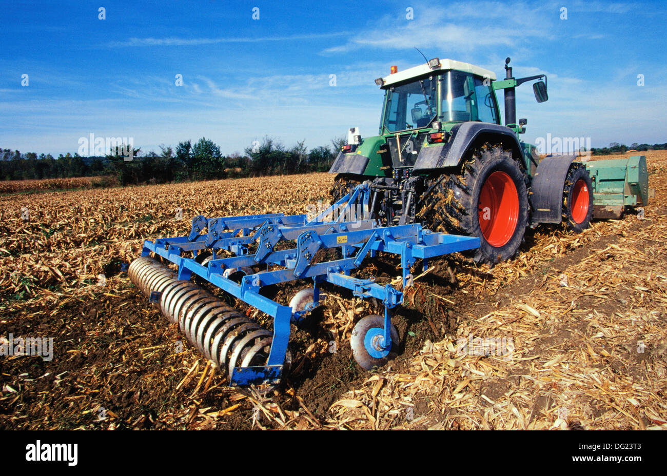 Tractor in corn field Stock Photo - Alamy