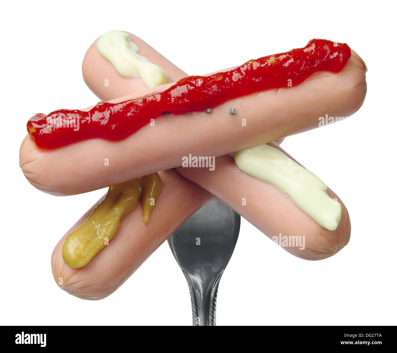 Three sausages on a fork with a different sauce, isolated on white Stock Photo