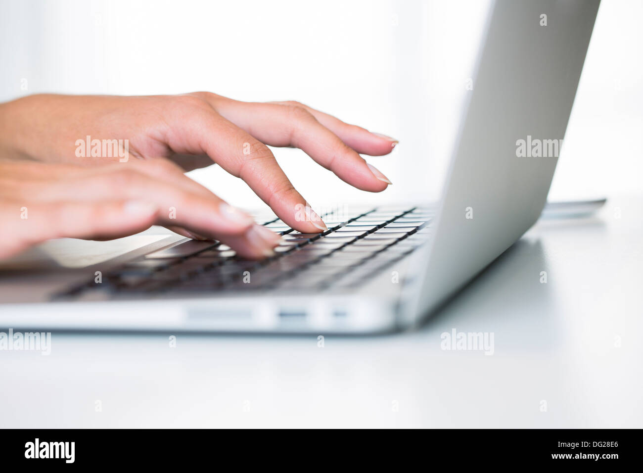 woman computer finger button desk Stock Photo