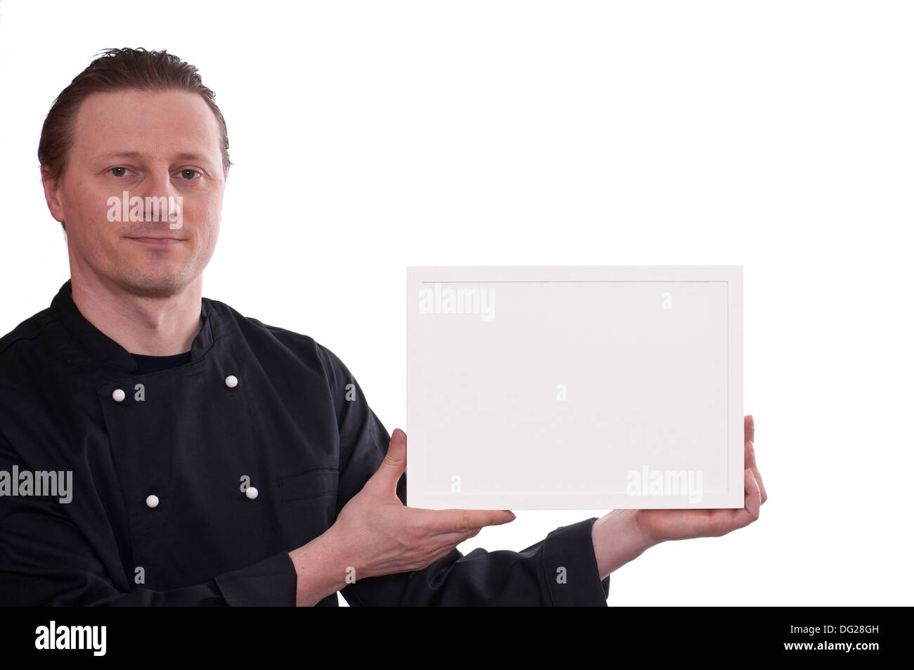 A man as cook is upholding a white frame Stock Photo