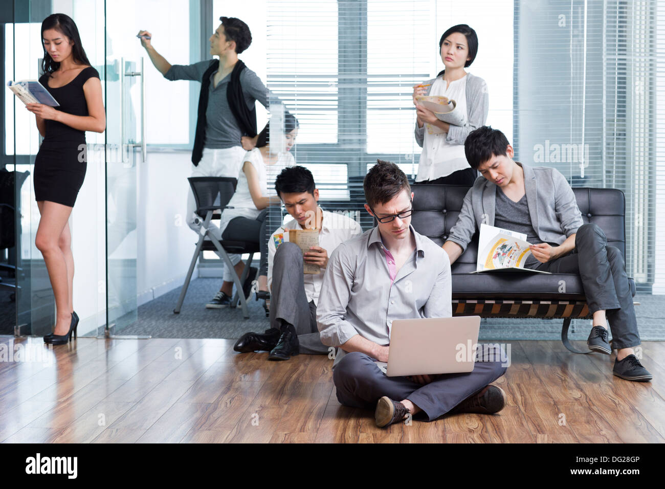Office workers pondering over thorny problems Stock Photo