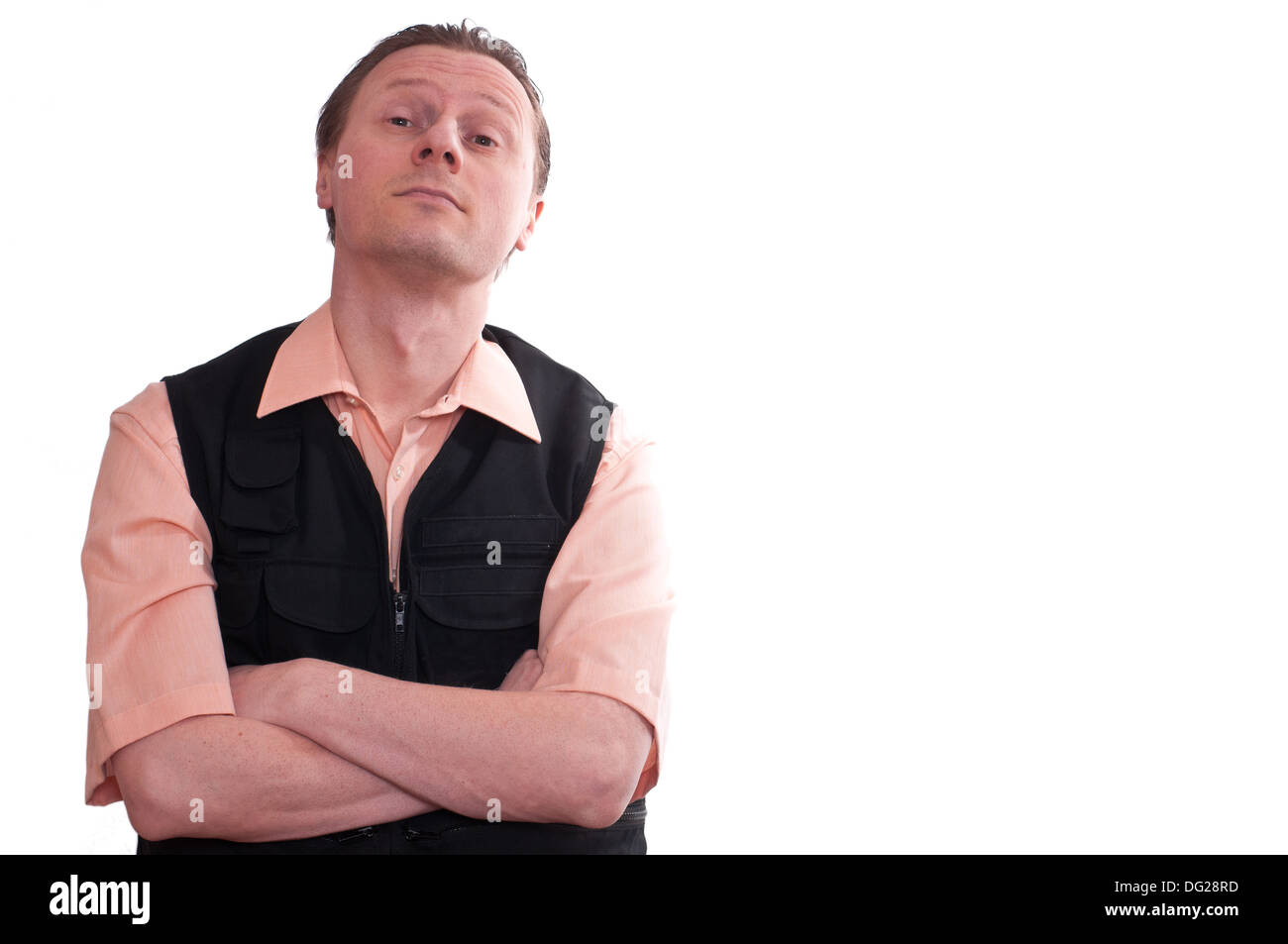 A man with crossed arme is looking sniffy and sceptical Stock Photo