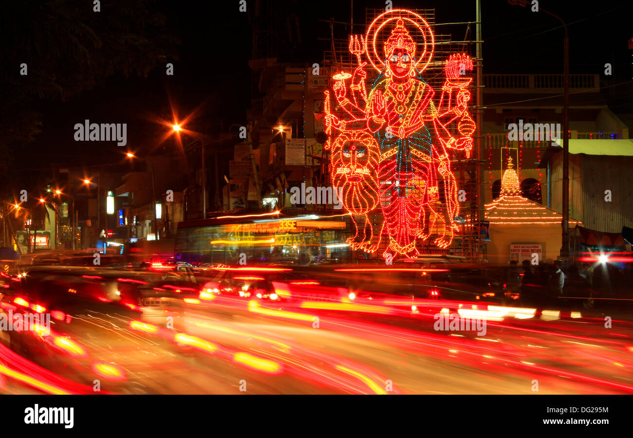 Bangalore, India. 12th Oct, 2013. Large lit-up art form of Hindu godess Durga during rush hour traffic in Bangalore, India. The festival of Durga pooja lasts for a week starting October 9th. © The Right Vibes/Alamy Live News Stock Photo