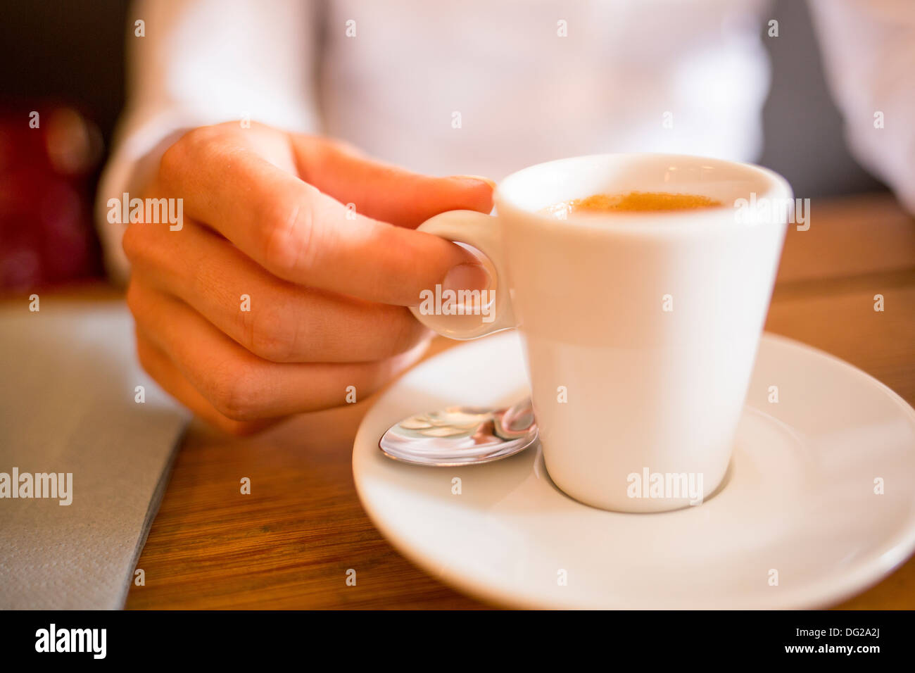 Female restaurant hand coffee table Stock Photo