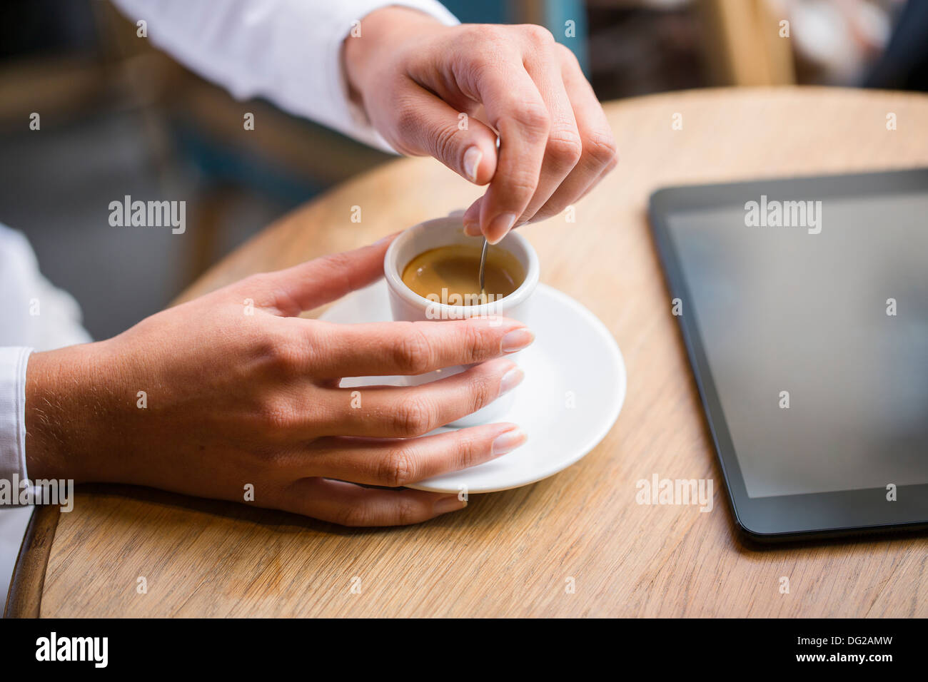 Female restaurant hand coffee computer Stock Photo