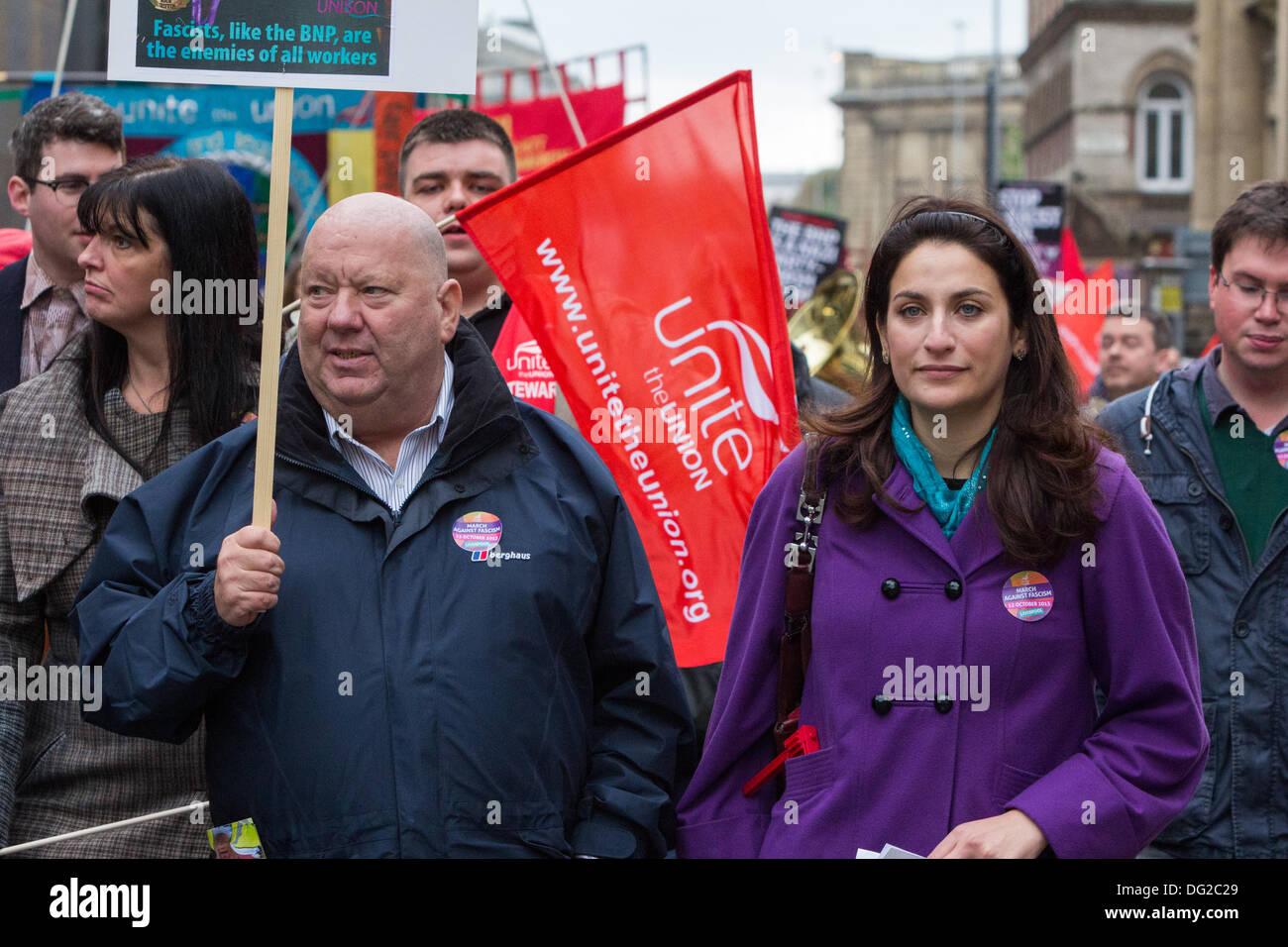 Hundreds of demonstrators accompanied by political figures including the Mayor of Liverpool Joe Anderson (left) and Shadow Minister for Public Health Luciana Berger (right) joined a march through Liverpool city centre on Saturday, October 12, 2013 which focused on the tagline 'Celebrating Not Dividing'. The demonstration which was called by Unite the Union, was held to spread the message that far-right British National Party (BNP) leader Nick Griffin must be defeated at the European Parliament elections in 2014. Stock Photo