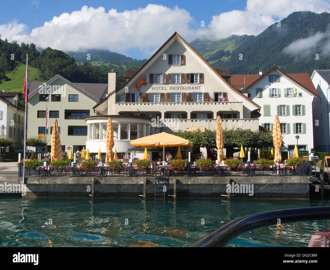 Boat trip on Lake Lucerne Switzerland, view of Hotel Restaurant Rössli in Beckenried Stock Photo